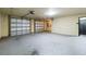Spacious two car garage with two garage doors and a door to the outside at 1793 N Fort Harrison Ave, Clearwater, FL 33755
