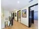 Bright hallway with wood floors and decorative wall art at 1793 N Fort Harrison Ave, Clearwater, FL 33755