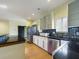 Modern kitchen boasts stainless steel appliances, granite countertops, and sleek cabinetry at 1793 N Fort Harrison Ave, Clearwater, FL 33755