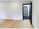 Living room featuring hardwood floors and an open doorway to the stairs at 1793 N Fort Harrison Ave, Clearwater, FL 33755