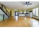 Expansive living room featuring an open floorplan with stairs and direct views into the kitchen at 1793 N Fort Harrison Ave, Clearwater, FL 33755