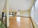 Open-concept living room with hardwood floors, ceiling fan, and lots of natural light at 1793 N Fort Harrison Ave, Clearwater, FL 33755