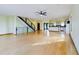 Bright open living area with stairs leading to upper floor and hardwood floors at 1793 N Fort Harrison Ave, Clearwater, FL 33755