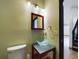 Stylish powder room featuring a vessel sink and modern fixtures at 1793 N Fort Harrison Ave, Clearwater, FL 33755
