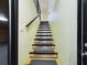 Staircase with black and silver accents, leading to the upper floor at 1793 N Fort Harrison Ave, Clearwater, FL 33755