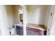 Bathroom with dark wood vanity, granite countertop, sink, toilet, and a mirror at 5406 Fishhawk Ridge Dr, Lithia, FL 33547