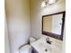 Bathroom featuring a vanity with dark wood and white countertop with a mirror at 5406 Fishhawk Ridge Dr, Lithia, FL 33547
