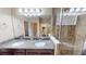 Bathroom with granite counter tops, double sinks, large mirror and a spacious glass shower at 5406 Fishhawk Ridge Dr, Lithia, FL 33547