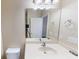 Bathroom featuring a large mirror above the sink, white counter, and neutral paint at 5406 Fishhawk Ridge Dr, Lithia, FL 33547