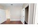 Bedroom with hardwood floors, two white doors, tan walls and white trim at 5406 Fishhawk Ridge Dr, Lithia, FL 33547