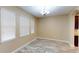 Bright dining room with new floors, multiple windows, and chandelier at 5406 Fishhawk Ridge Dr, Lithia, FL 33547
