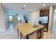 Open-concept kitchen with stainless steel appliances, granite counters, and tile floors at 5406 Fishhawk Ridge Dr, Lithia, FL 33547