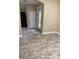 Spacious living area with light, bright walls and stylish floors providing lots of natural light at 5406 Fishhawk Ridge Dr, Lithia, FL 33547