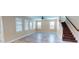 Spacious living room with wood floors and multiple windows offering natural light at 5406 Fishhawk Ridge Dr, Lithia, FL 33547