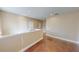 Hardwood floors and recessed lighting featured in a spacious loft area with tan walls at 5406 Fishhawk Ridge Dr, Lithia, FL 33547