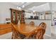 A dining area with a wooden table and chairs, open to the kitchen at 8418 Sandy Beach St, Tampa, FL 33634