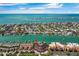 An aerial view of waterfront condos with private boat docks and a beautiful location on the water and beaches at 722 Pinellas Bayway S # 102, St Petersburg, FL 33715