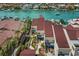 An aerial view shows waterfront condos, private boat docks and a beautiful waterfront location on the water at 722 Pinellas Bayway S # 102, St Petersburg, FL 33715