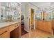 Bathroom with tiled floor, granite countertops, and a separate vanity area at 722 Pinellas Bayway S # 102, St Petersburg, FL 33715
