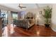 Bedroom featuring a large bed, ceiling fan, and sliding glass doors at 722 Pinellas Bayway S # 102, St Petersburg, FL 33715