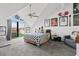 Bedroom with vaulted ceiling and sliding glass door to patio at 722 Pinellas Bayway S # 102, St Petersburg, FL 33715