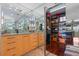 Walk-in closet with hardwood floors, granite countertops, and a large mirror at 722 Pinellas Bayway S # 102, St Petersburg, FL 33715