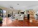 Open living room with hardwood floors and water views at 722 Pinellas Bayway S # 102, St Petersburg, FL 33715