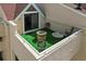 Cozy rooftop deck with artificial turf and fire pit at 722 Pinellas Bayway S # 102, St Petersburg, FL 33715