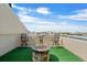 Enjoy panoramic views from this rooftop terrace with a charming fire pit and comfortable seating area at 722 Pinellas Bayway S # 102, St Petersburg, FL 33715