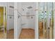 Walk-in shower with tile floor, tile walls, and glass doors at 722 Pinellas Bayway S # 102, St Petersburg, FL 33715