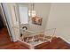 Staircase with white railing and wood steps at 722 Pinellas Bayway S # 102, St Petersburg, FL 33715