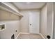 Laundry room with ceramic tile flooring, utility connections and a door leading to the exterior at 11606 Tropical Isle Ln, Riverview, FL 33579