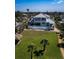 Aerial view of a stunning two-story home with a pool, guest house, and expansive yard at 764 S Mccall Rd, Englewood, FL 34223