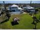 An aerial view shows the large property featuring a home, guest house, and gazebo at 764 S Mccall Rd, Englewood, FL 34223