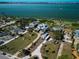 Stunning aerial view showcases lush landscaping, waterfront access, and a desirable neighborhood setting at 764 S Mccall Rd, Englewood, FL 34223
