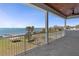 Enjoy serene views of the water and lush landscaping from this spacious balcony at 764 S Mccall Rd, Englewood, FL 34223