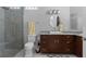 Bathroom featuring a glass-enclosed shower, granite countertops, and modern fixtures for a luxurious experience at 764 S Mccall Rd, Englewood, FL 34223