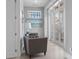 Elegant entryway featuring wainscotting, a seating area, and stylish decor at 764 S Mccall Rd, Englewood, FL 34223