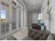 Bright entryway featuring seating, transom windows, and stylish decor at 764 S Mccall Rd, Englewood, FL 34223