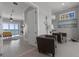 Inviting entryway leading to water view with transom windows and a seating area at 764 S Mccall Rd, Englewood, FL 34223