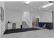 This large garage features a work area with a sink, storage cabinets, and stairway access at 764 S Mccall Rd, Englewood, FL 34223
