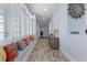 Bright hallway with a window seat and storage cabinet at 764 S Mccall Rd, Englewood, FL 34223