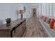 Hallway with decorative pillows in the window seat, and a wooden credenza at 764 S Mccall Rd, Englewood, FL 34223