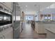 Bright, spacious kitchen with stainless steel appliances and a view into the dining area at 764 S Mccall Rd, Englewood, FL 34223