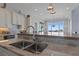 Elegant kitchen showcasing granite countertops, stainless steel appliances, and a breakfast bar at 764 S Mccall Rd, Englewood, FL 34223