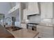Well-appointed kitchen boasting granite counters, stainless steel appliances, and custom cabinetry at 764 S Mccall Rd, Englewood, FL 34223
