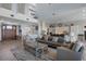 Spacious living area with an open floor plan, wood floors, and access to kitchen and dining at 764 S Mccall Rd, Englewood, FL 34223