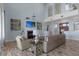Elegant living room featuring a cozy fireplace, wood floors, and soaring ceilings at 764 S Mccall Rd, Englewood, FL 34223