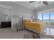 Bright main bedroom suite with private bathroom access and breathtaking water views from the balcony at 764 S Mccall Rd, Englewood, FL 34223