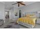 Main bedroom featuring wood floors, ensuite bathroom and multiple entry doors, provides a private retreat at 764 S Mccall Rd, Englewood, FL 34223